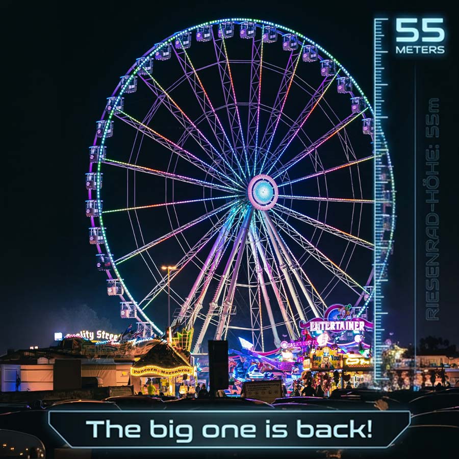 Ein großes, 55m hohes Riesenrad bei Nacht auf dem Herbstfest Rummel in Dresden